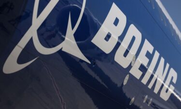 A logo on the body of a Boeing Co. 777-9 passenger aircraft at the Dubai Air Show in Dubai