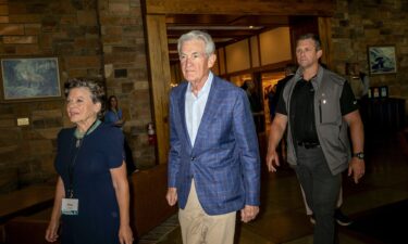 Federal Reserve Chair Jerome Powell arrives to a dinner at the Jackson Lake Lodge during the Kansas City Fed's economic symposium in Moran