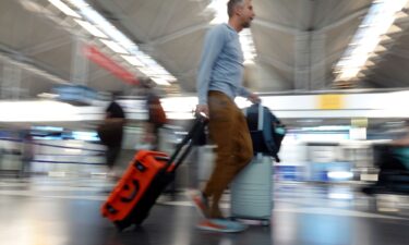 Travelers arrive at O'Hare International Airport in Chicago for Labor Day weekend travel in 2023.