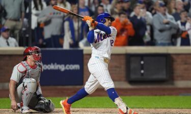 New York Mets owner Steve Cohen celebrates with shortstop Francisco Lindor after defeating the Philadelphia Phillies in game four of the NLDS.