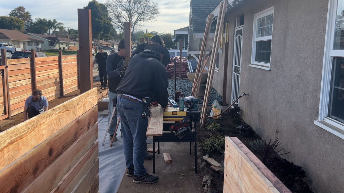 Home Depot employees improve local veteran's front yard with 