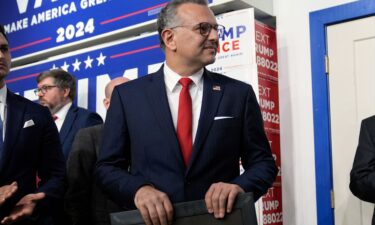 Massad Boulos listens as Former President Donald Trump speaks at a campaign office on October 18 in Hamtramck