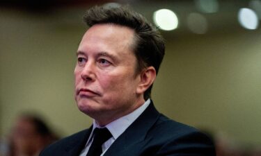 Tesla CEO and X owner Elon Musk listens as US President-elect Donald Trump speaks during a meeting with House Republicans at the Hyatt Regency hotel in Washington