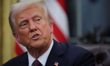 President Donald Trump speaks as he issues executive orders and pardons for January 6 defendants in the Oval Office at the White House on Inauguration Day in Washington