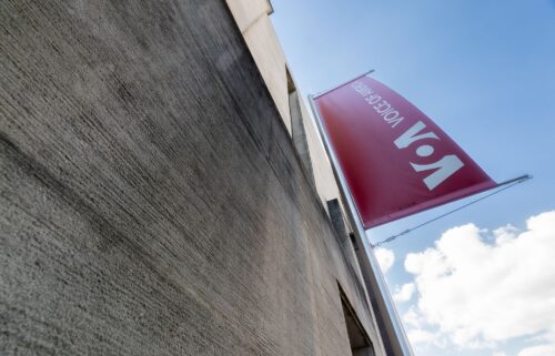 A banner hangs on the side of the Voice of America (VOA) headquarters building in Washington