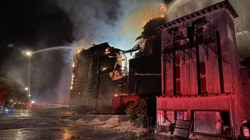 Templeton Feed & Grain catches fire and is fought all night by firefighters