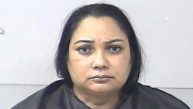 Woman arrested, accused of playing doctor in her backyard