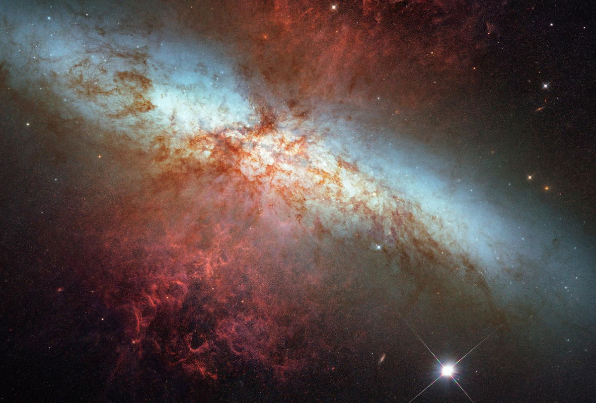 A Hubble Space Telescope composite image shows a supernova explosion designated SN 2014J in the galaxy M82.