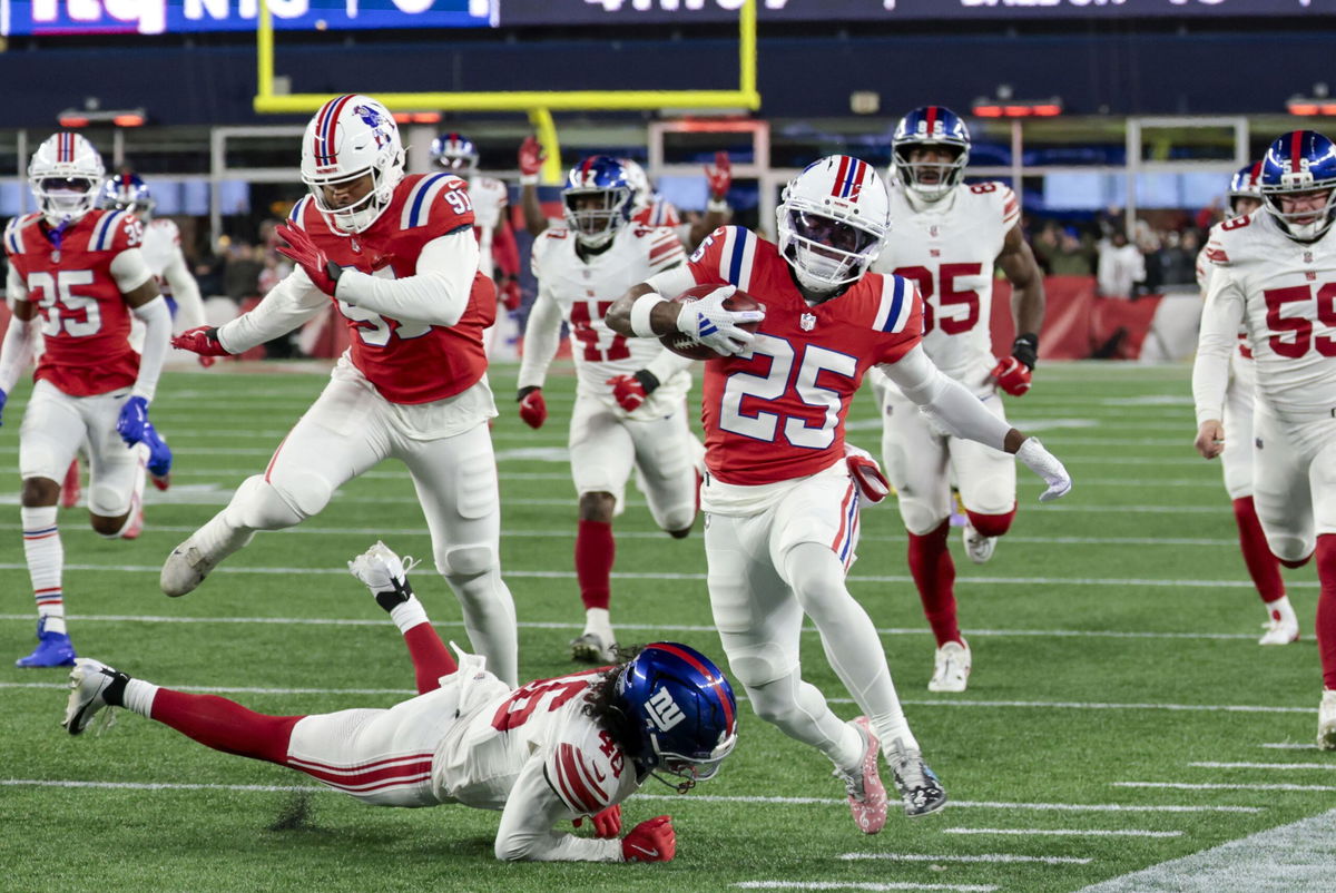 Drake Maye runs off the field after the win over the Giants at Gillette Stadium.